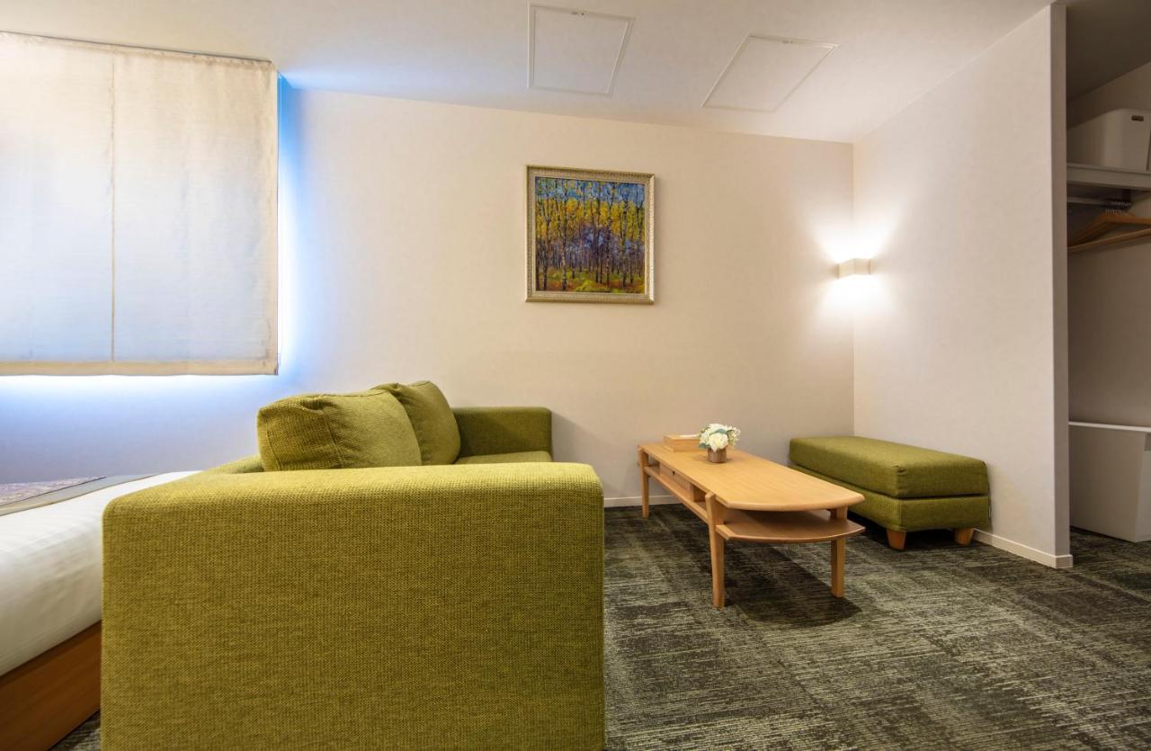 GRAND BASE Okayama Ekimae Aparthotel Bagian luar foto