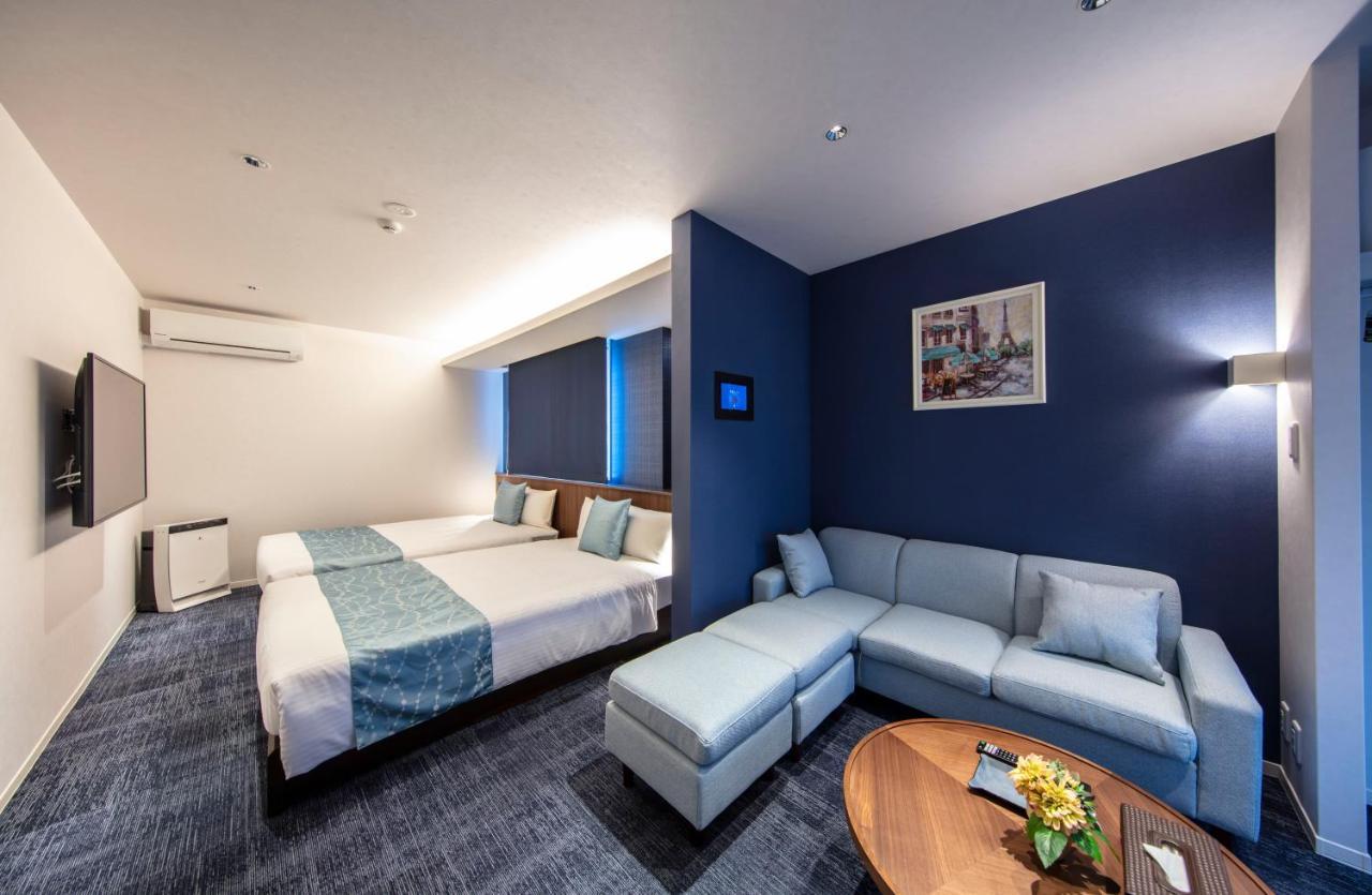 GRAND BASE Okayama Ekimae Aparthotel Bagian luar foto