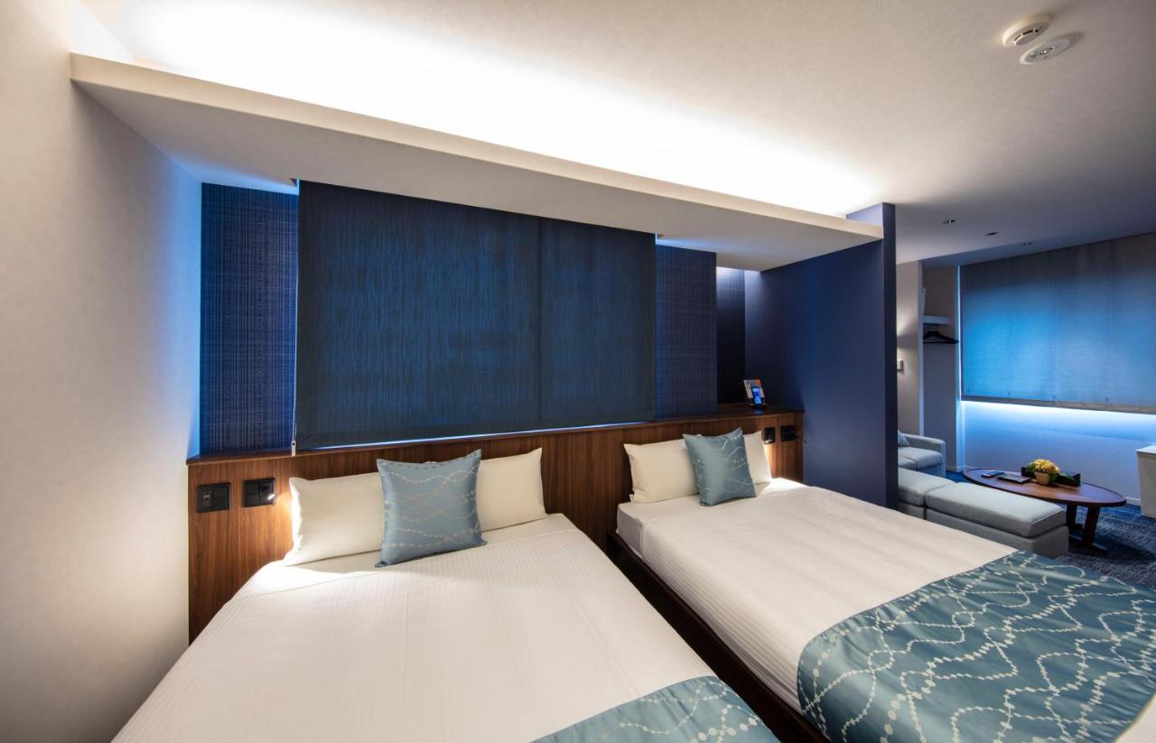 GRAND BASE Okayama Ekimae Aparthotel Bagian luar foto