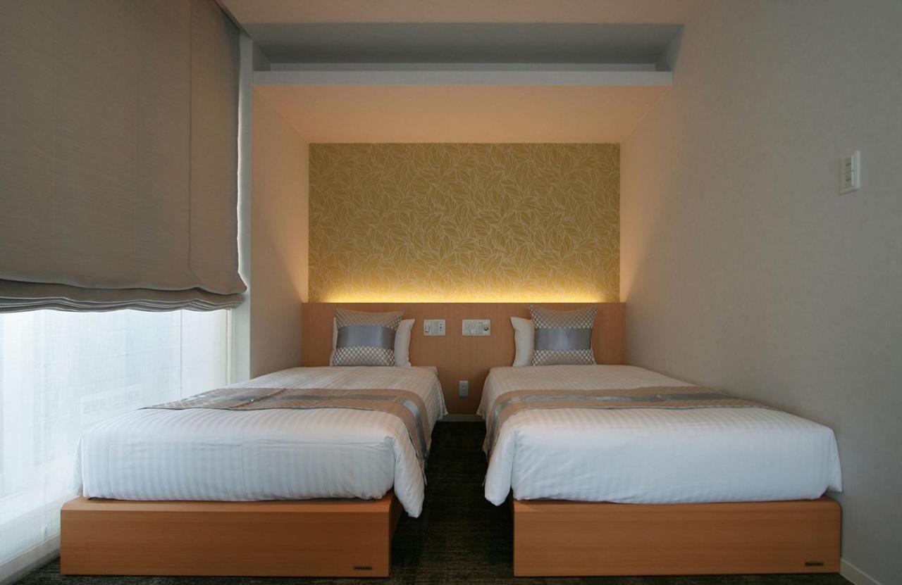 GRAND BASE Okayama Ekimae Aparthotel Bagian luar foto
