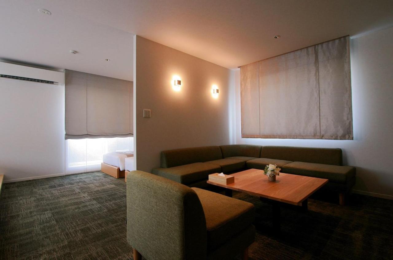 GRAND BASE Okayama Ekimae Aparthotel Bagian luar foto