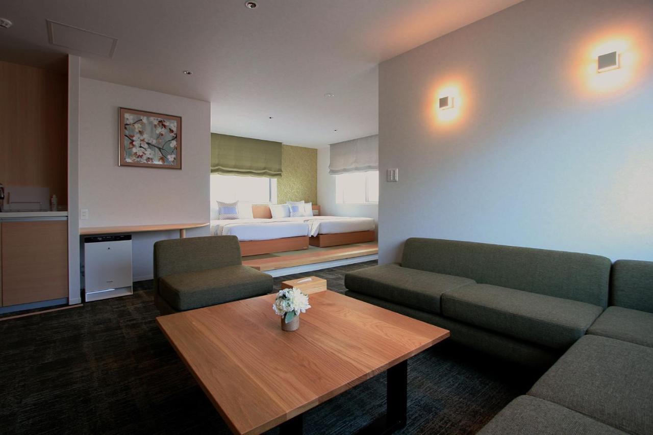 GRAND BASE Okayama Ekimae Aparthotel Bagian luar foto