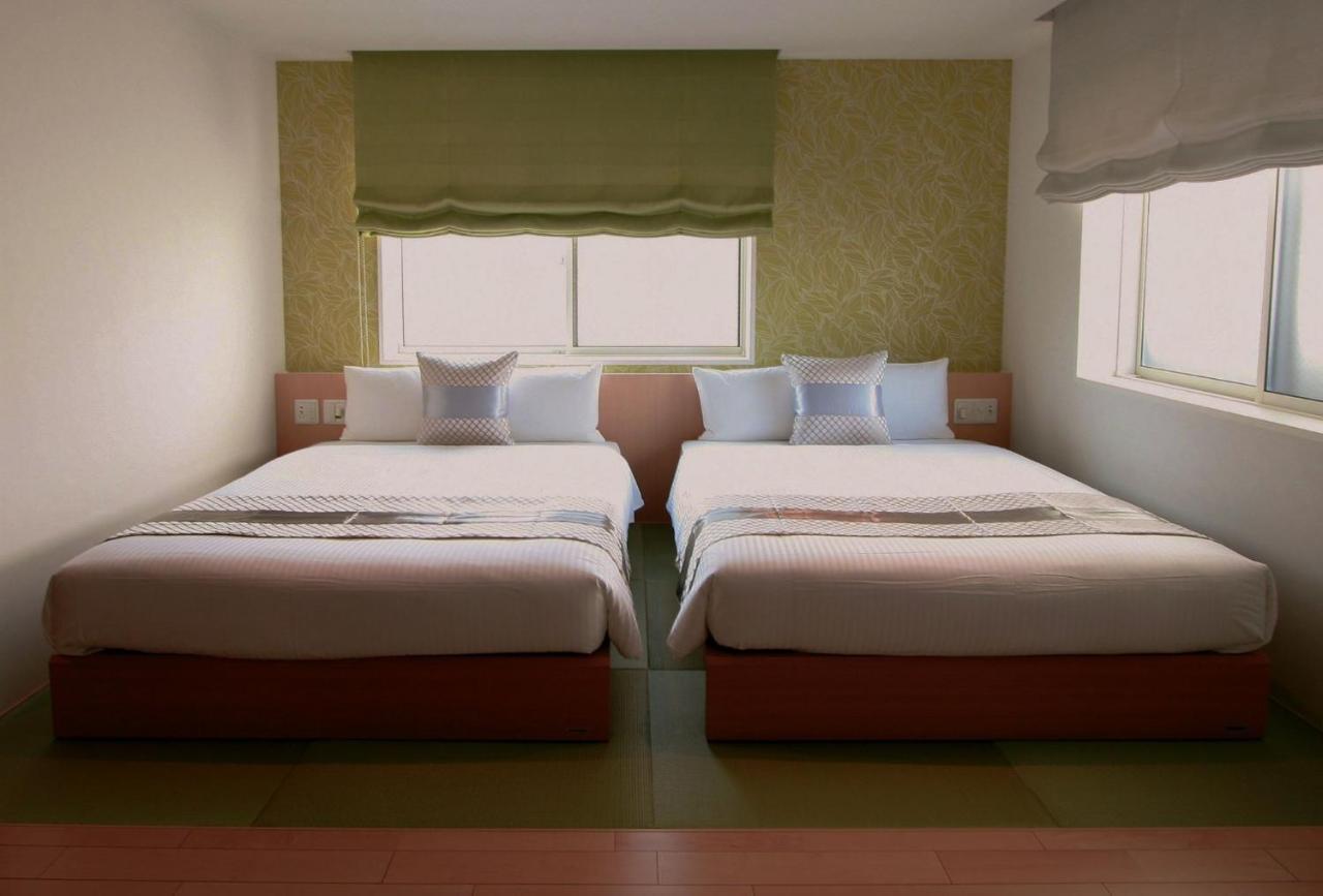 GRAND BASE Okayama Ekimae Aparthotel Bagian luar foto