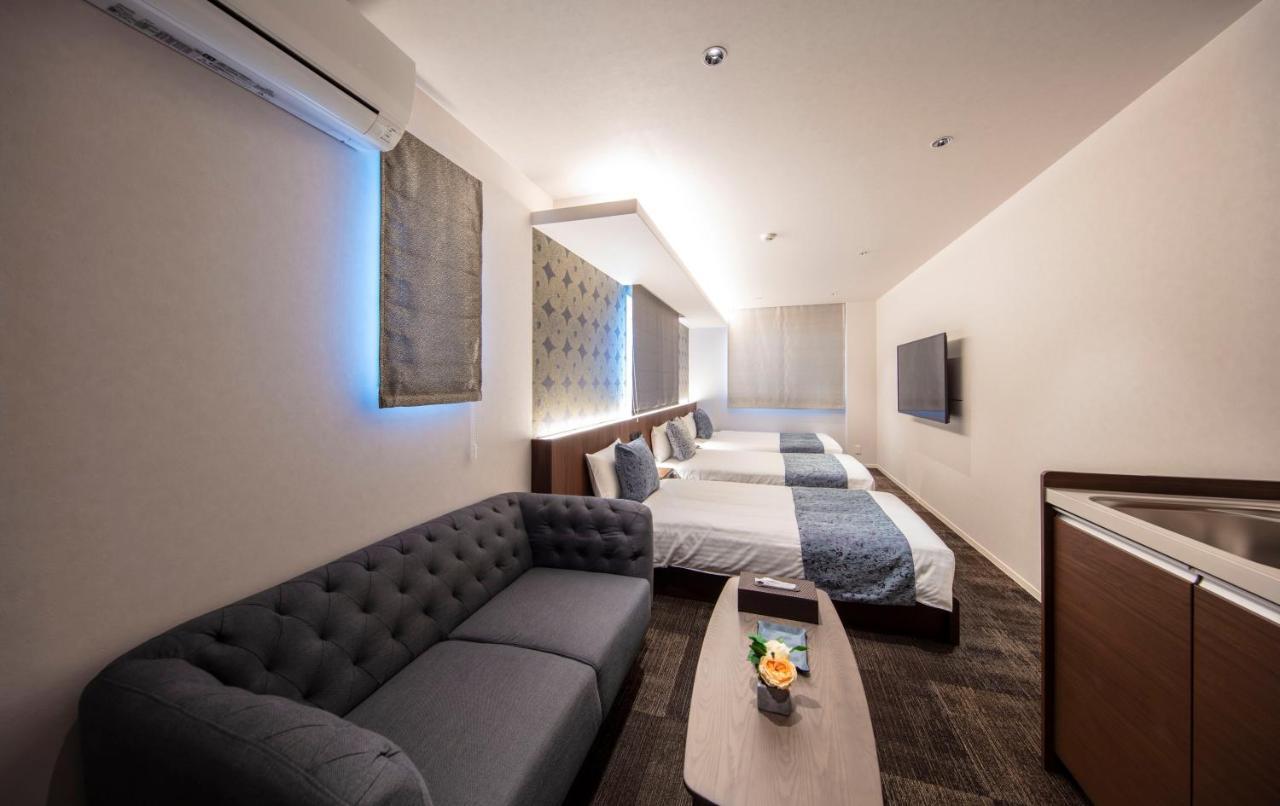 GRAND BASE Okayama Ekimae Aparthotel Bagian luar foto