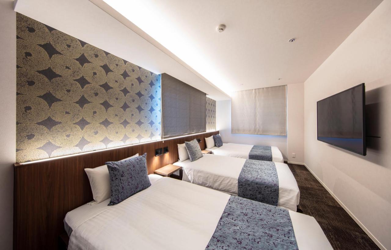 GRAND BASE Okayama Ekimae Aparthotel Bagian luar foto