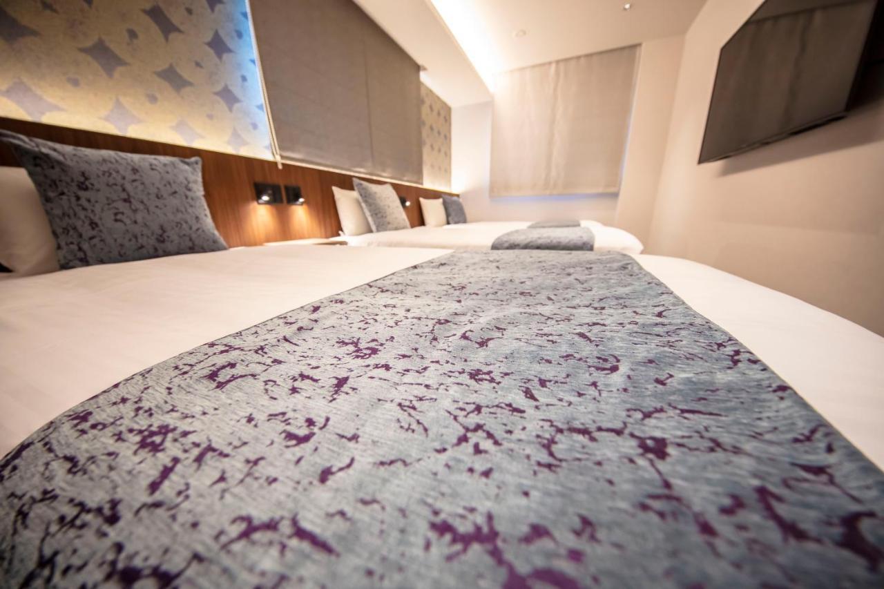GRAND BASE Okayama Ekimae Aparthotel Bagian luar foto