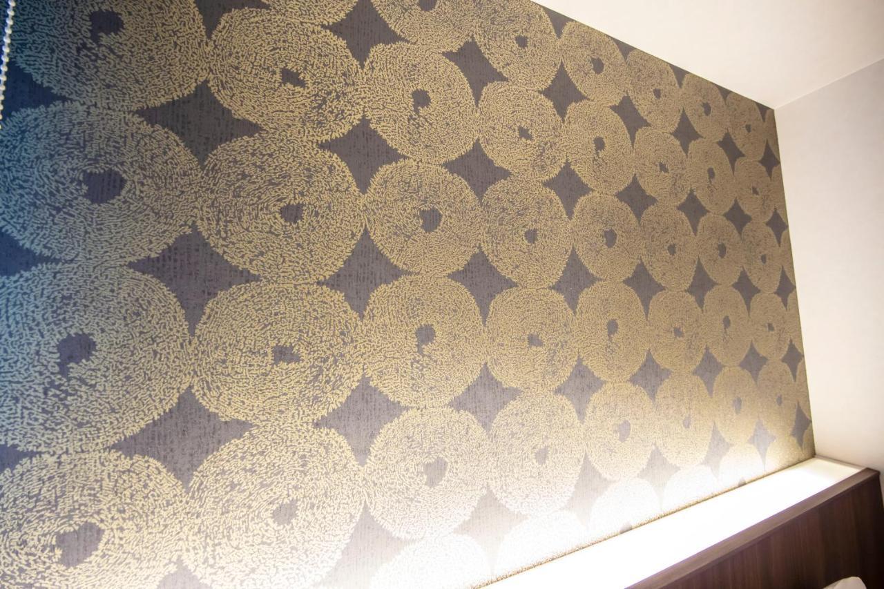 GRAND BASE Okayama Ekimae Aparthotel Bagian luar foto