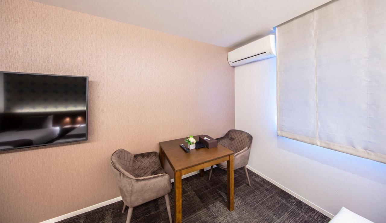 GRAND BASE Okayama Ekimae Aparthotel Bagian luar foto