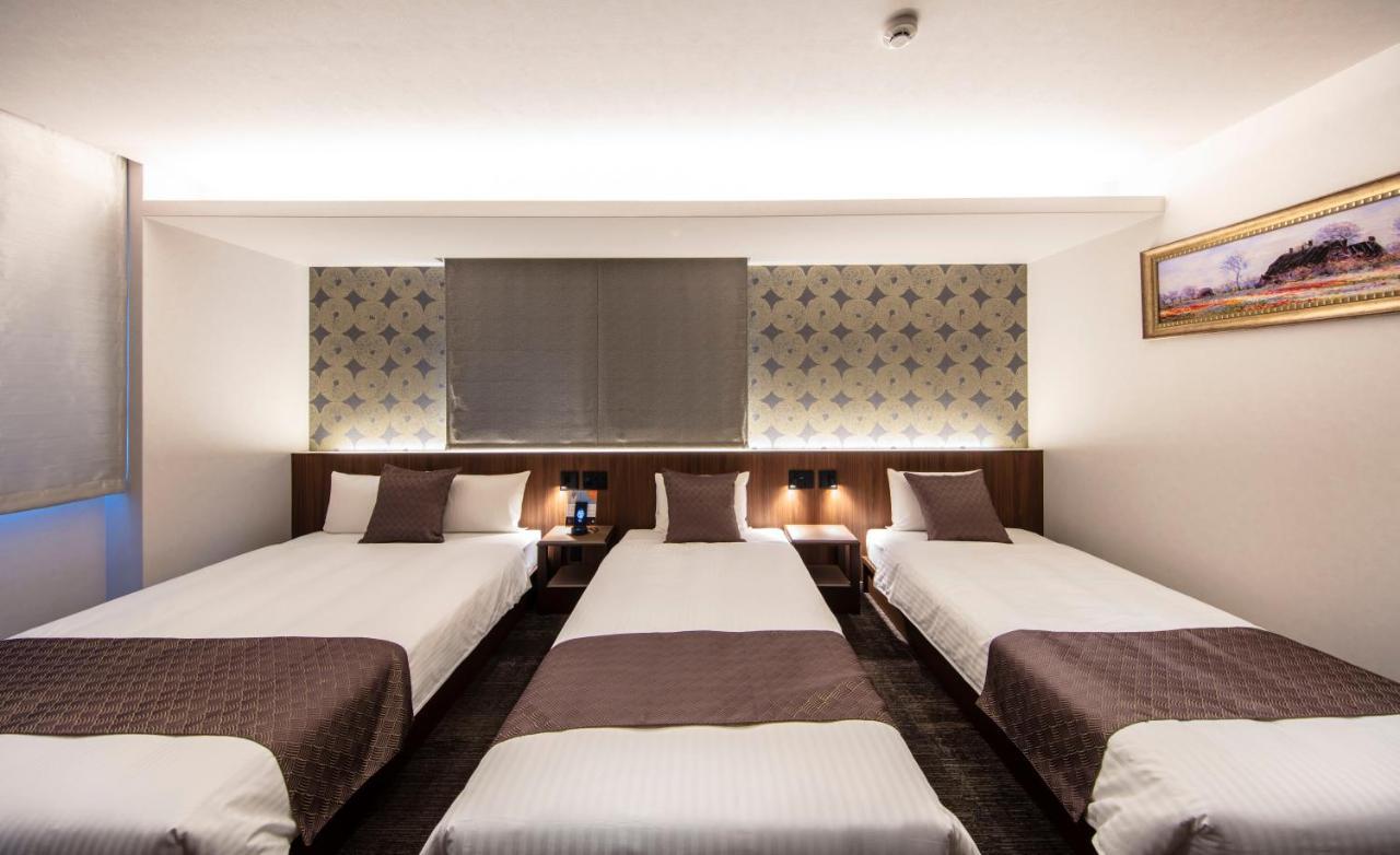 GRAND BASE Okayama Ekimae Aparthotel Bagian luar foto