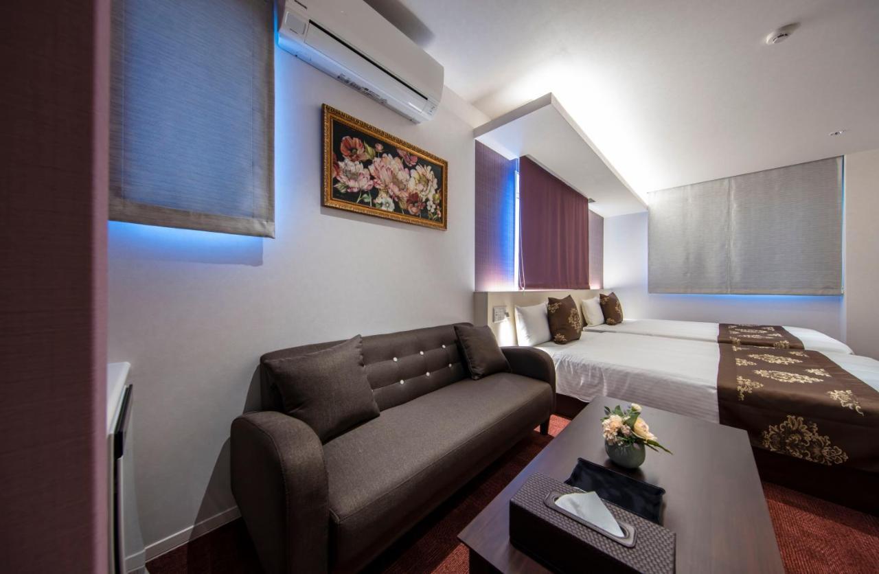 GRAND BASE Okayama Ekimae Aparthotel Bagian luar foto