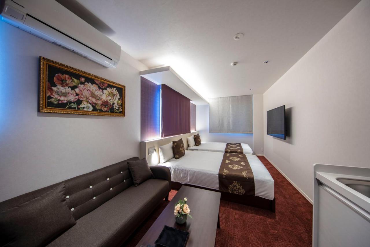 GRAND BASE Okayama Ekimae Aparthotel Bagian luar foto