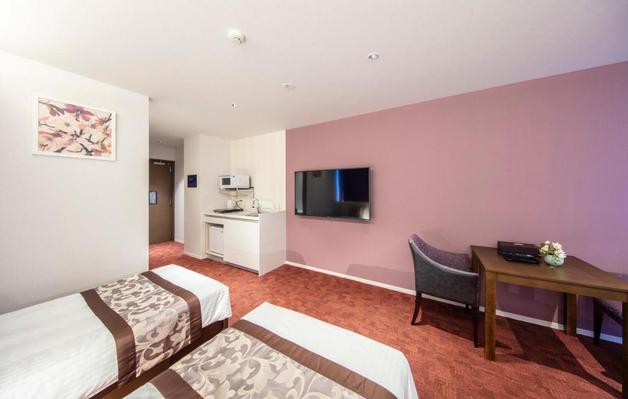 GRAND BASE Okayama Ekimae Aparthotel Bagian luar foto