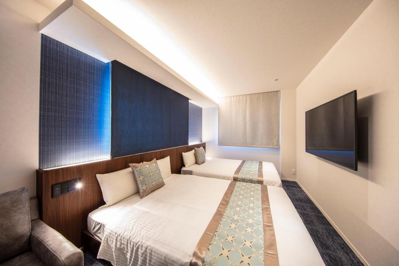 GRAND BASE Okayama Ekimae Aparthotel Bagian luar foto