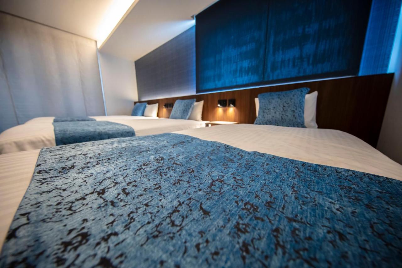 GRAND BASE Okayama Ekimae Aparthotel Bagian luar foto