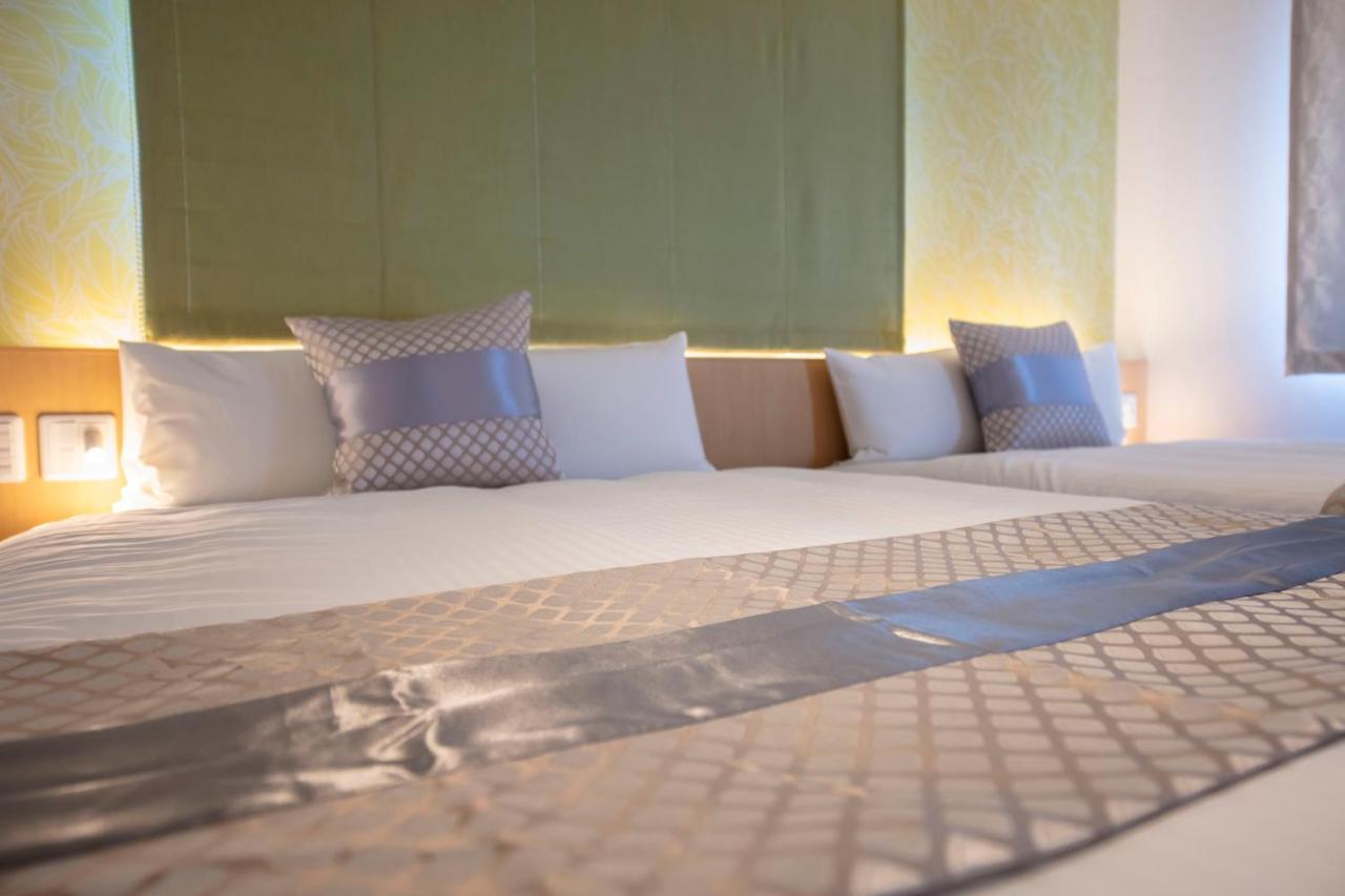 GRAND BASE Okayama Ekimae Aparthotel Bagian luar foto