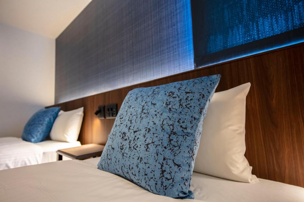 GRAND BASE Okayama Ekimae Aparthotel Bagian luar foto