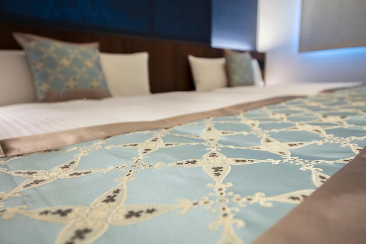 GRAND BASE Okayama Ekimae Aparthotel Bagian luar foto