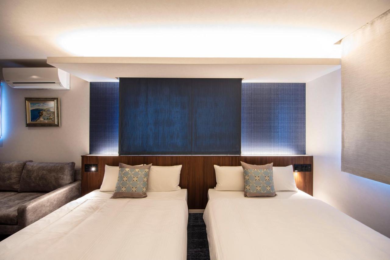 GRAND BASE Okayama Ekimae Aparthotel Bagian luar foto