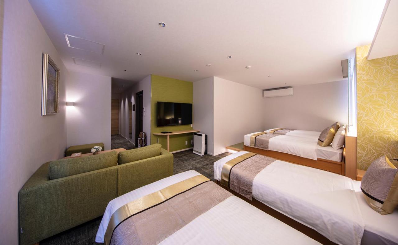 GRAND BASE Okayama Ekimae Aparthotel Bagian luar foto