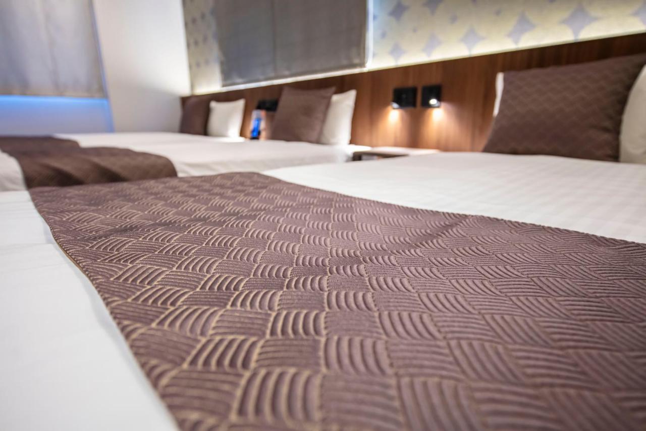 GRAND BASE Okayama Ekimae Aparthotel Bagian luar foto