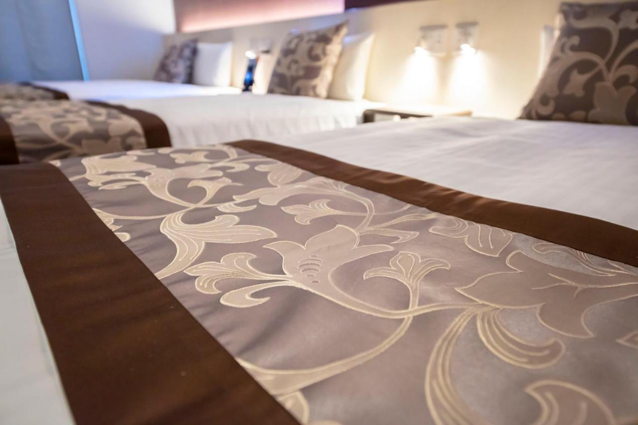 GRAND BASE Okayama Ekimae Aparthotel Bagian luar foto