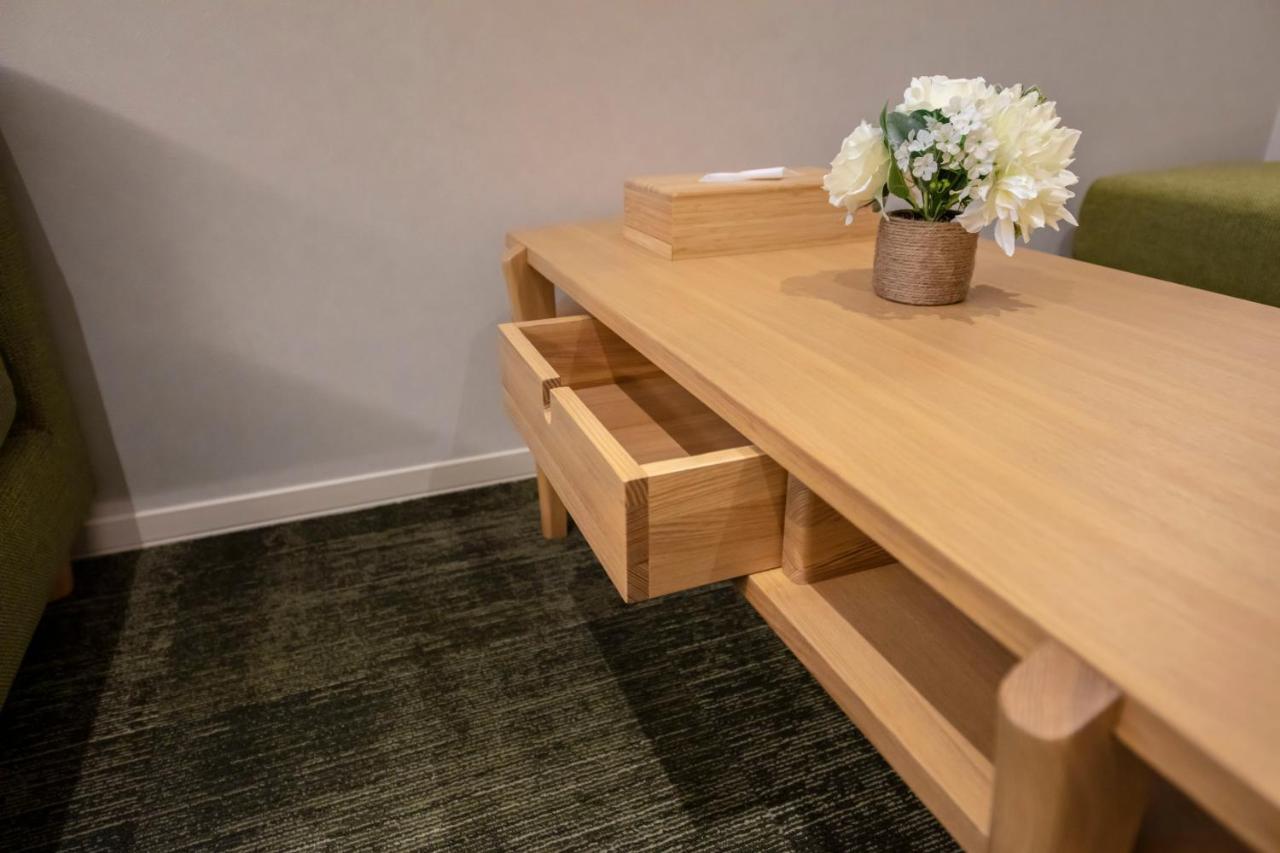 GRAND BASE Okayama Ekimae Aparthotel Bagian luar foto