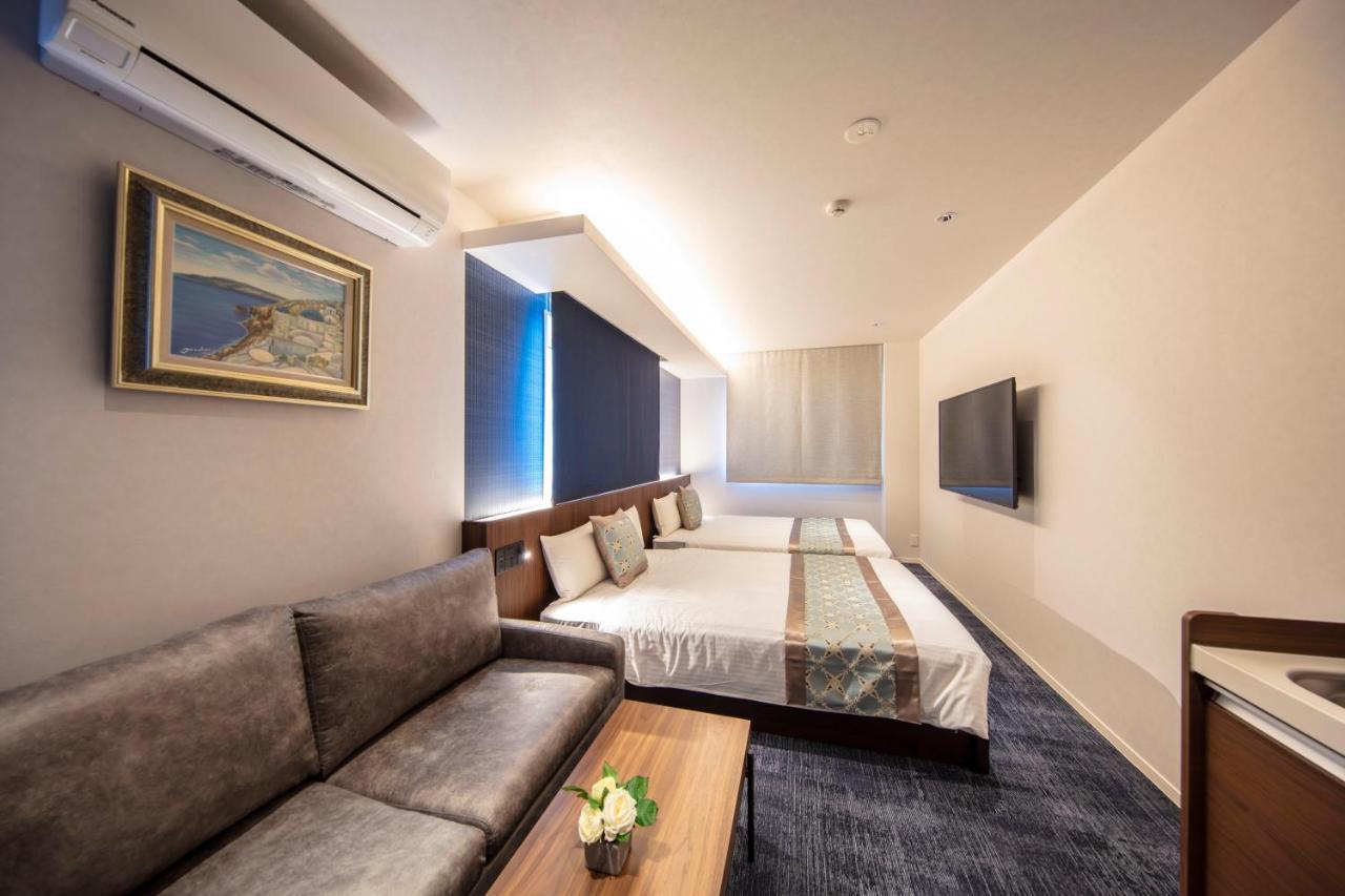 GRAND BASE Okayama Ekimae Aparthotel Bagian luar foto