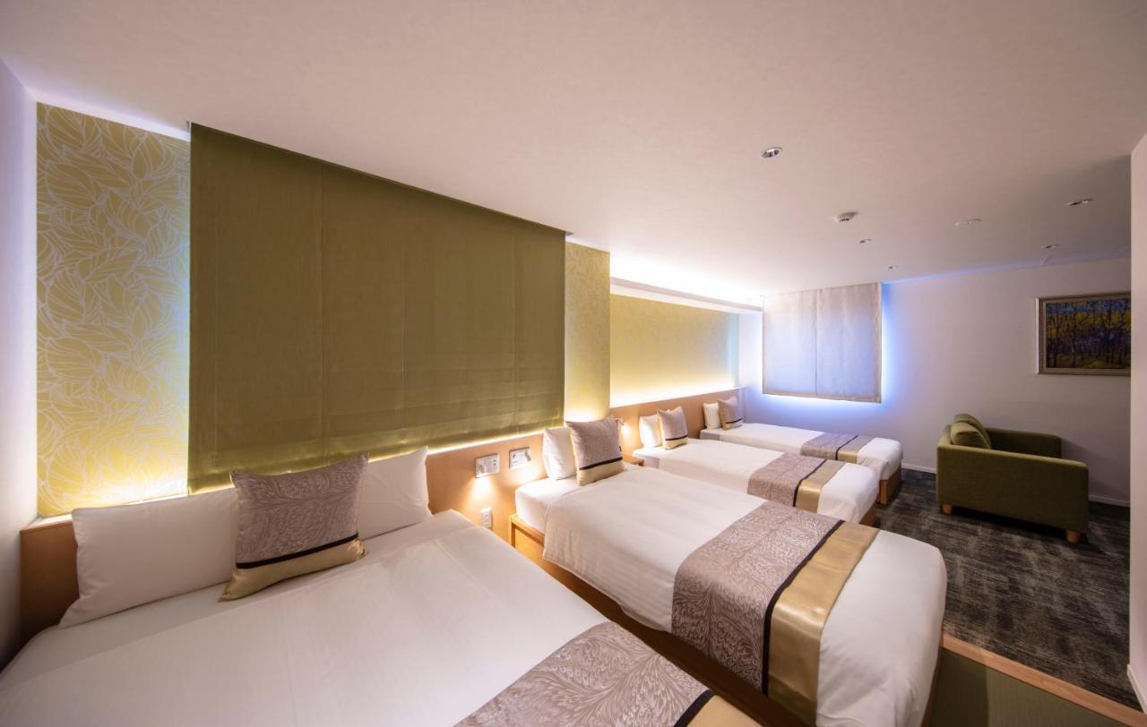 GRAND BASE Okayama Ekimae Aparthotel Bagian luar foto