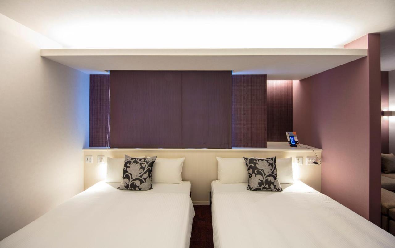 GRAND BASE Okayama Ekimae Aparthotel Bagian luar foto