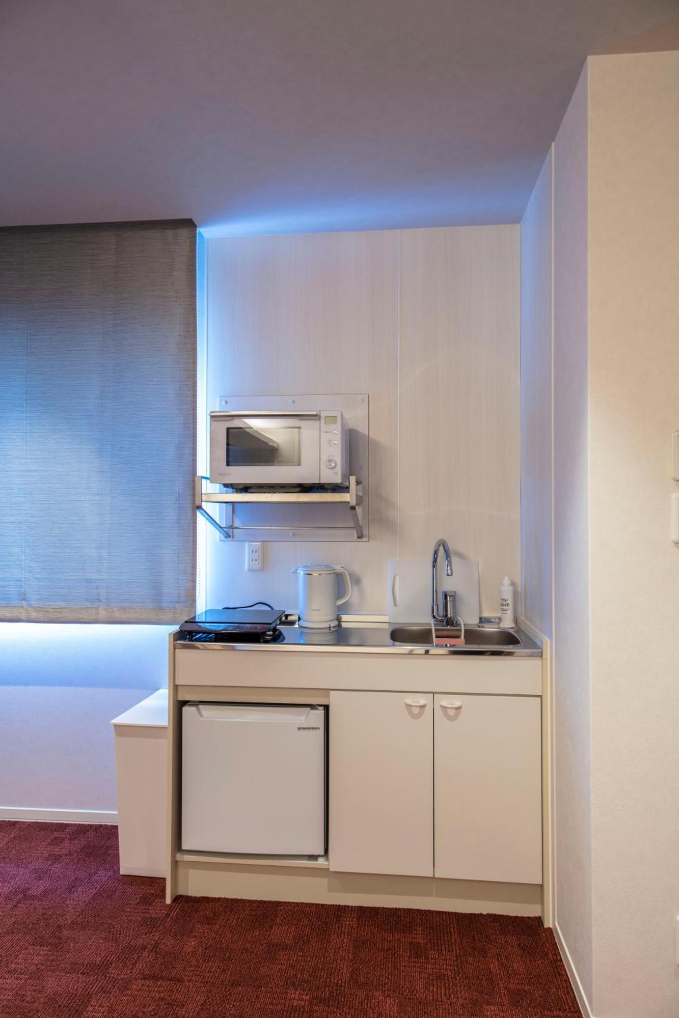 GRAND BASE Okayama Ekimae Aparthotel Bagian luar foto